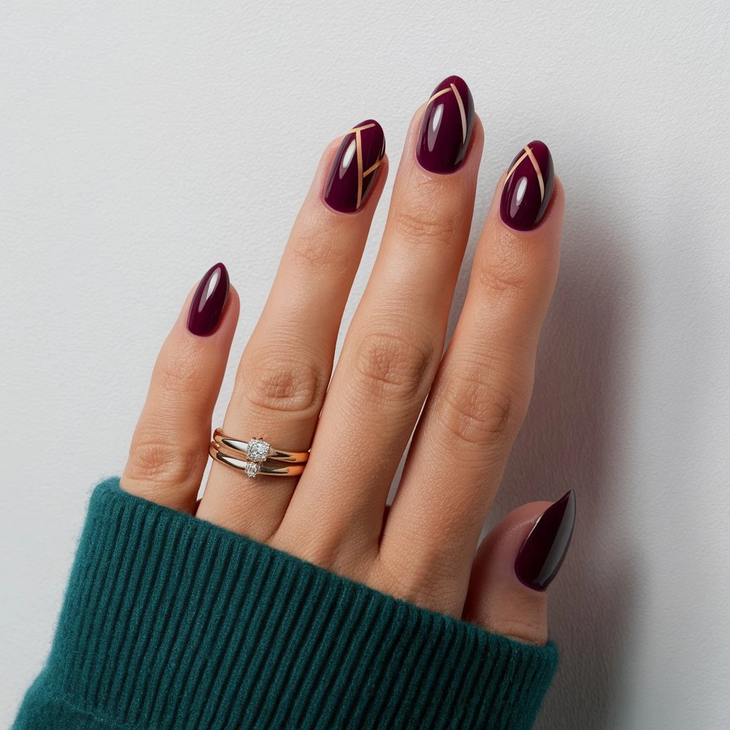Nails are painted with Glossy plum nails with simple geometric patterns and have a glossy finish.